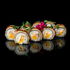 sushi rolls on black background