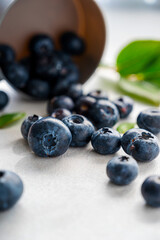 Blueberries fresh berry on bright background. Healthy food template, mockup with copy space.