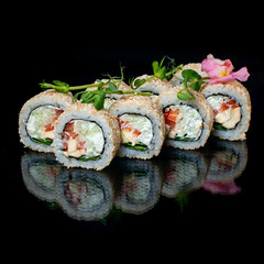 white sushi rolls on black background