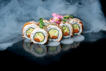 sushi on a black background with smoke