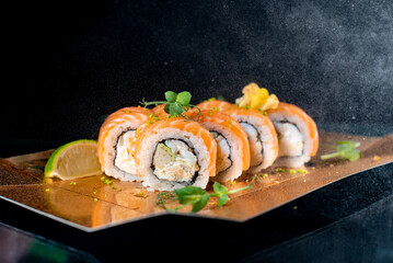 sushi on a black background