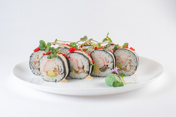 black and white sushi on plate