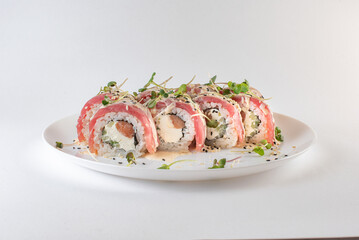 red sushi on a plate with souse