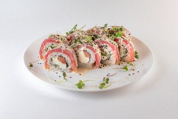 red sushi on a plate with souse
