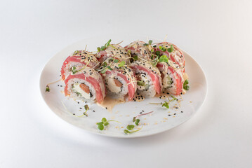 red sushi on a plate with souse