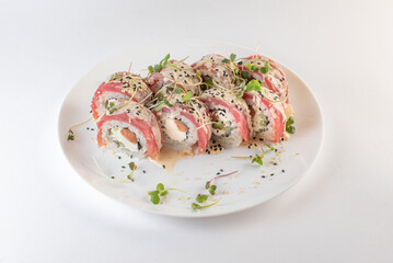 red sushi on a plate with souse