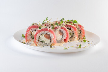 red sushi on a plate with souse