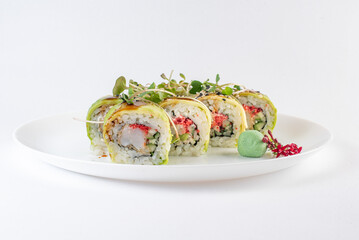 green sushi on a plate with vasabi