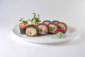 Black suhi rolls on white background