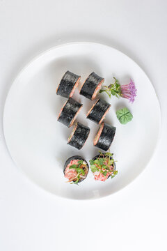 sushi rolls with avocado, salmon and vasabi