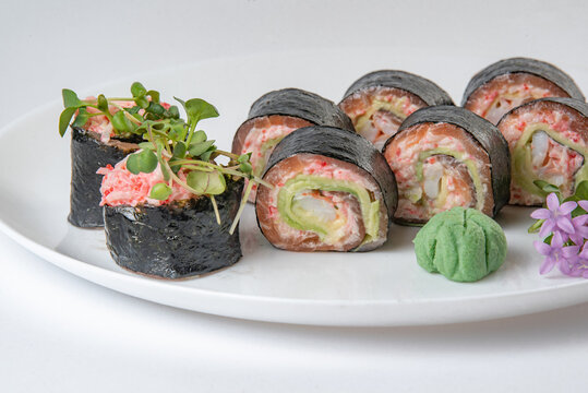 sushi rolls with avocado, salmon and vasabi