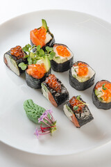 sushi rolls with avocado, salmon and vasabi