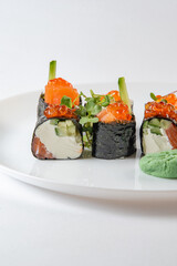 sushi rolls with avocado, salmon and vasabi