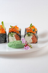 sushi rolls with avocado, salmon and vasabi