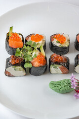 sushi rolls with avocado, salmon and vasabi