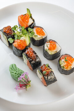 sushi rolls with avocado, salmon and vasabi