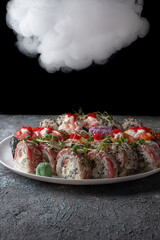 sushi with salmon in smoke