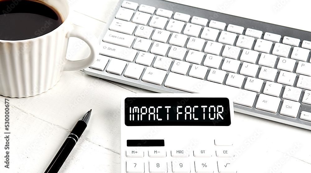 Aufkleber impact factor text on calculator with keyboard and coffee