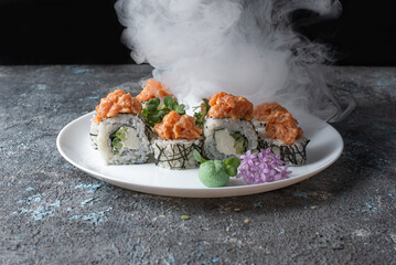 sushi with salmon in smoke