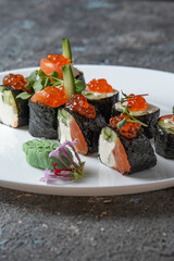 sushi rolls on white plate 