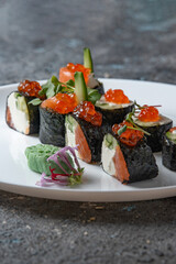 sushi rolls on white plate 