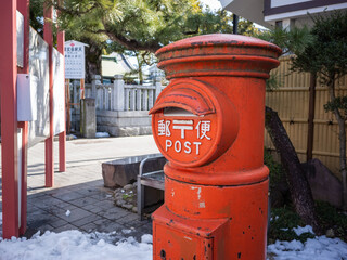 Fototapeta na wymiar an old type of post box on the street in tokyo