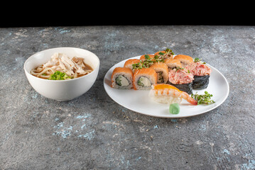 sushi with salmon and chicken soup