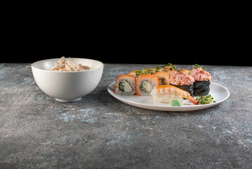 sushi with salmon and chicken soup