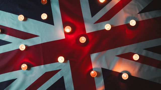 Mourning candles on Queen Elizabeth's flag of England