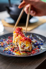 Woman eating sushi dessert