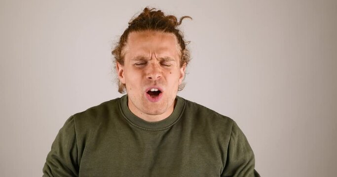 Male angry and confused to what is happening to or in front of him.