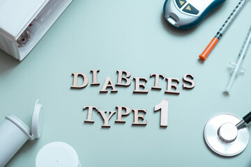 Inscription diabetes type 1 and glucometer, syringes and medical equipment on a colored background,...