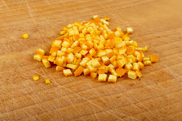 Raw Chopped Orange Peel, Zest on Wood Background