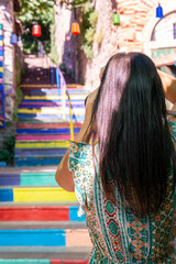 Unrecognizable photographer photographing colorful stairs in istanbul, turkey