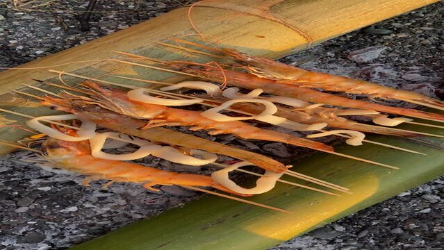 mix seafood barbecue cokking on bamboo sticks