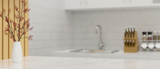 Luxury elegance white marble kitchen countertop with copy space over blurred kitchen cooking space