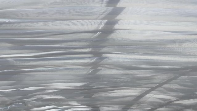 White fabric texture wind blowing background, texture of flying fabric.