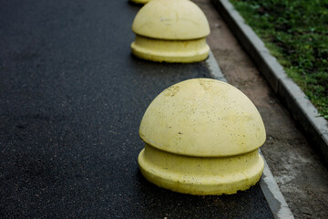Concrete yellow ball spheres bollard