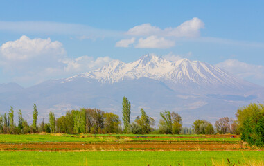 Erciyes Mount with height of 3,864 metres is the highest mountain in Cappadocia and central Anatolia. It is a volcano. - obrazy, fototapety, plakaty