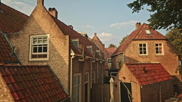 POV shot of a person walking past old houses in the historic fortified town of Heusden, Noord-Brabant, by morning.