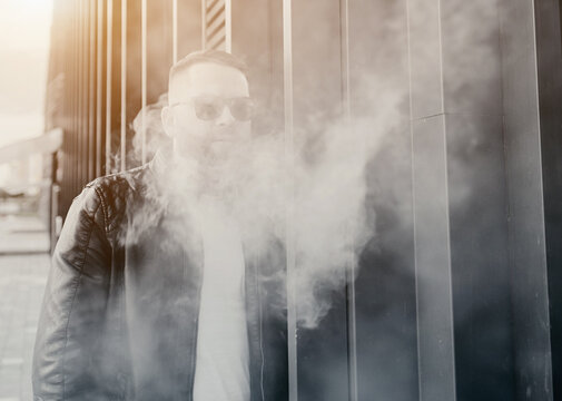 handsome guy smoking an electronic cigarette
