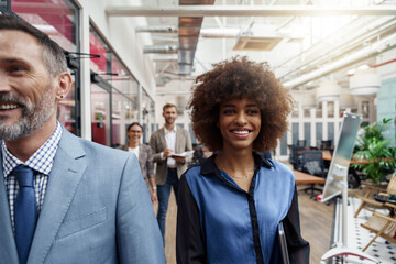 Group of multiethnic business people crossing office together