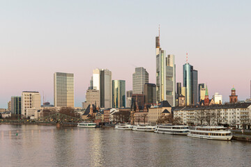 Naklejka premium sunrise with view to skyline of Frankfurt with river Main