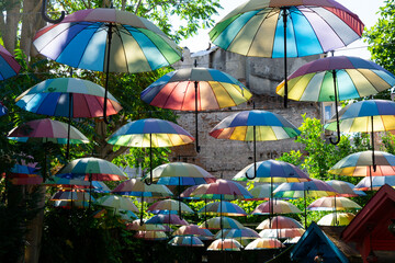 Istanbul's colorful street with colorful wooden huts and hanging umbrellas