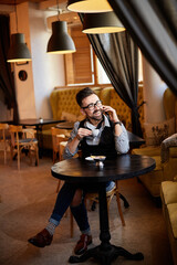 business man drinking coffee in a cafe
