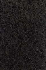 Sponge textured background. Black. Close up.