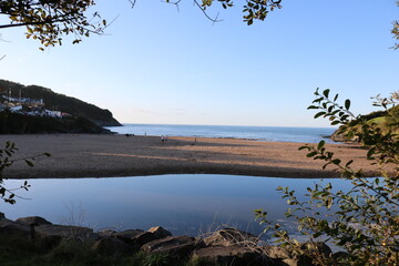 reflection of sky on beach