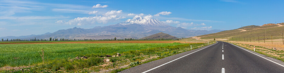 Erciyes Mount with height of 3,864 metres is the highest mountain in Cappadocia and central Anatolia. It is a volcano. - obrazy, fototapety, plakaty