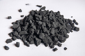 Shungite crumbs on a white background