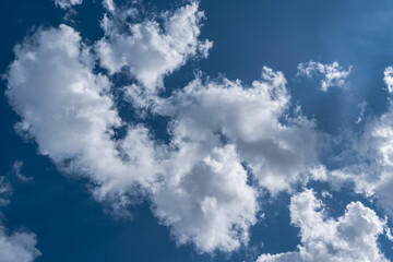 White clouds in the blue sky.